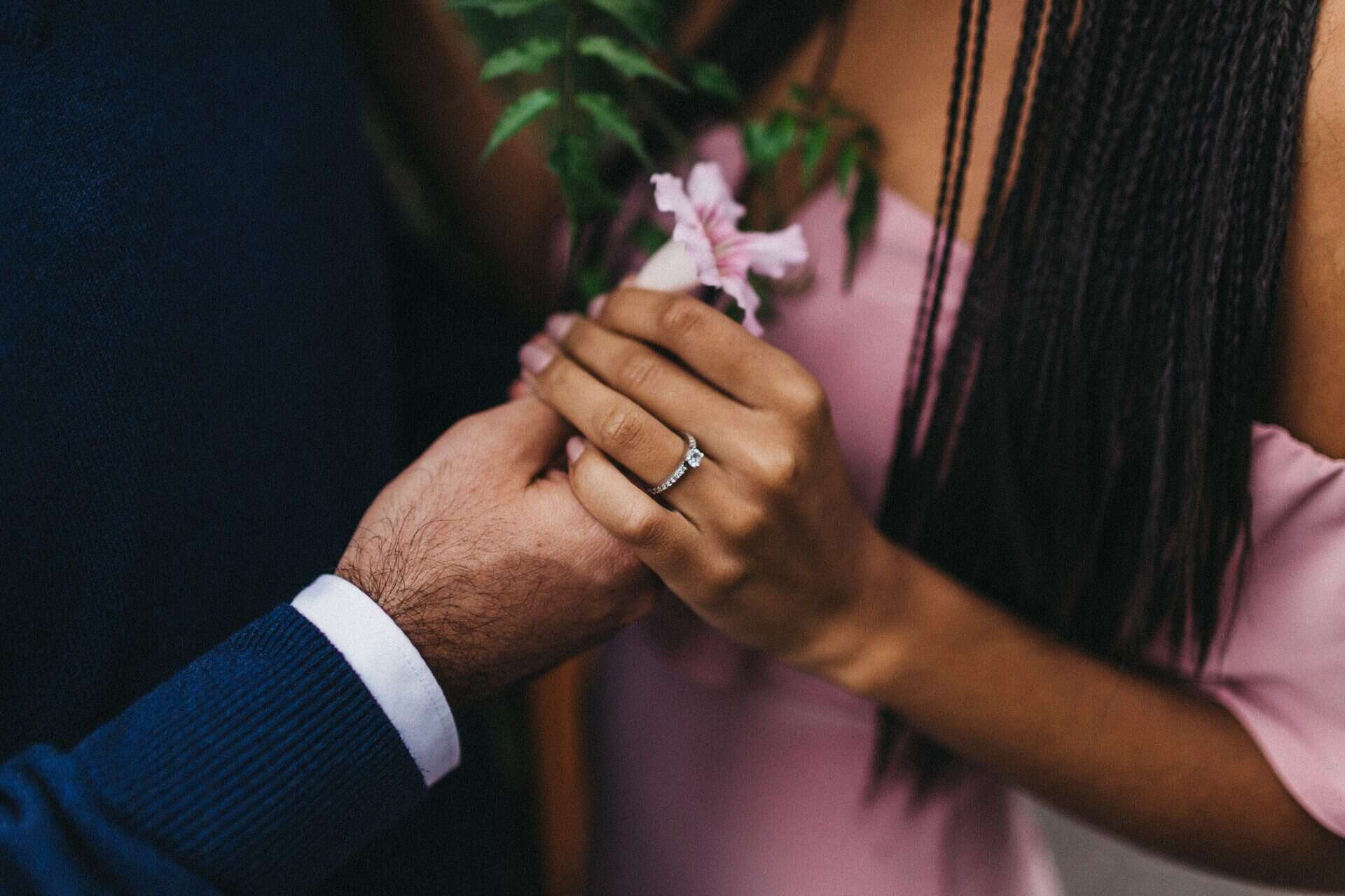 Soft embrace between a couple during an engagement session in Costa Rica, set against a lush, natural backdrop.