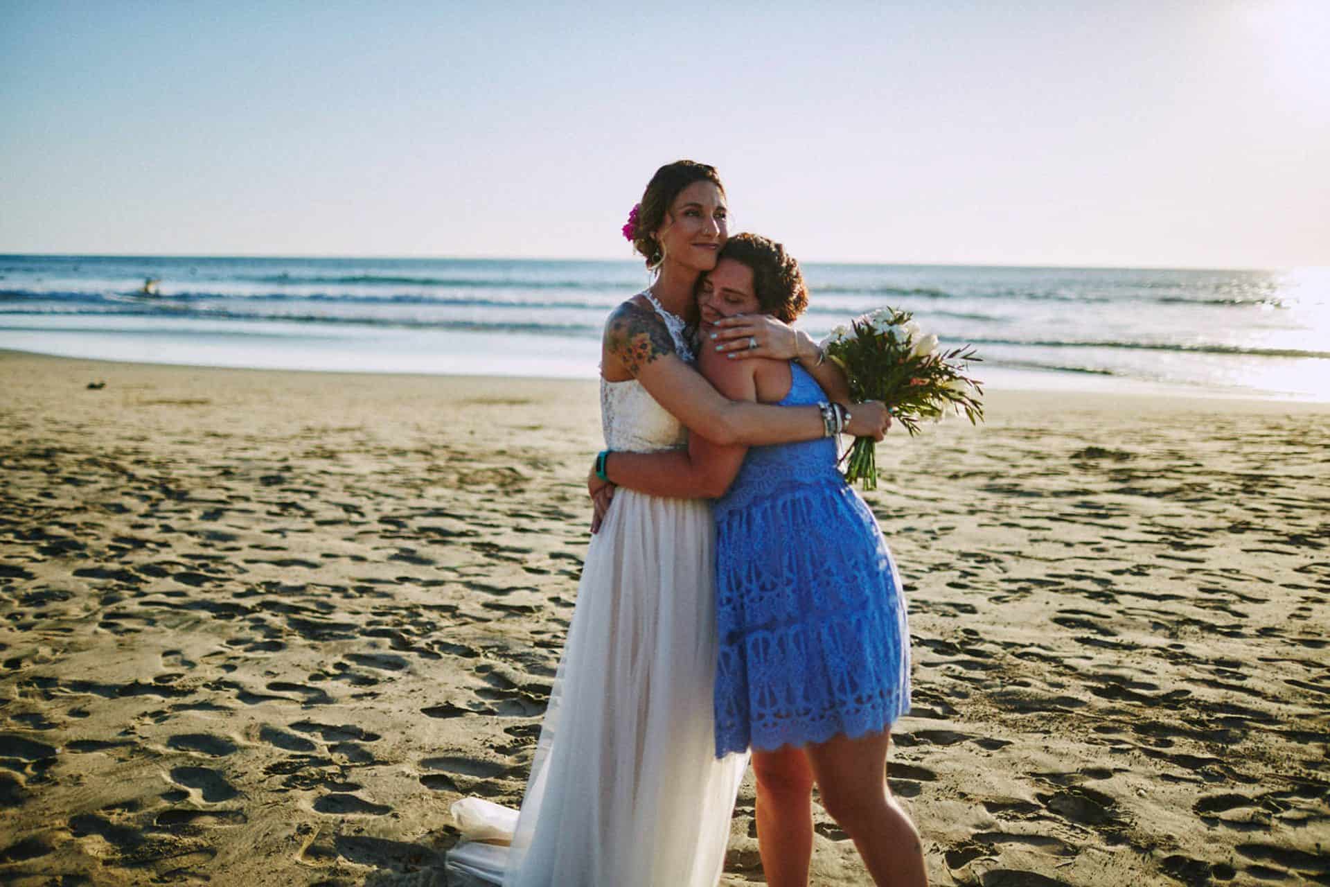 bride and bridesmaid hugging costa rica wedding guide January