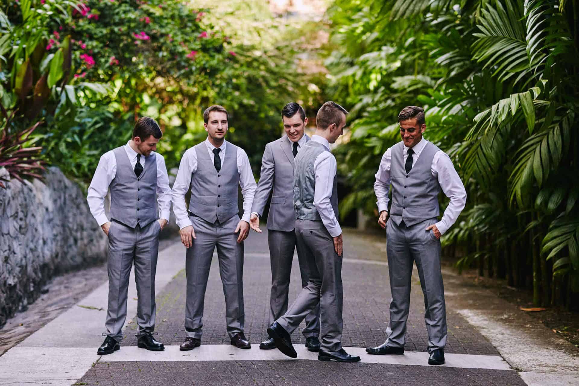groom and best groomsmen funny portrait at wedding in the springs resort and spa Arenal, Costa Rica