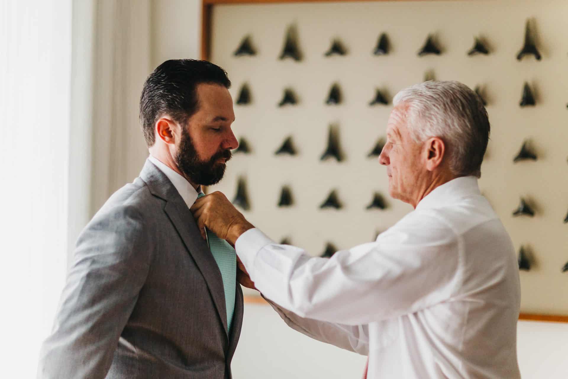 Groom getting ready with his father at beach wedding at El Mangroove hotel in papagayo costa rica costa rica wedding photography packages