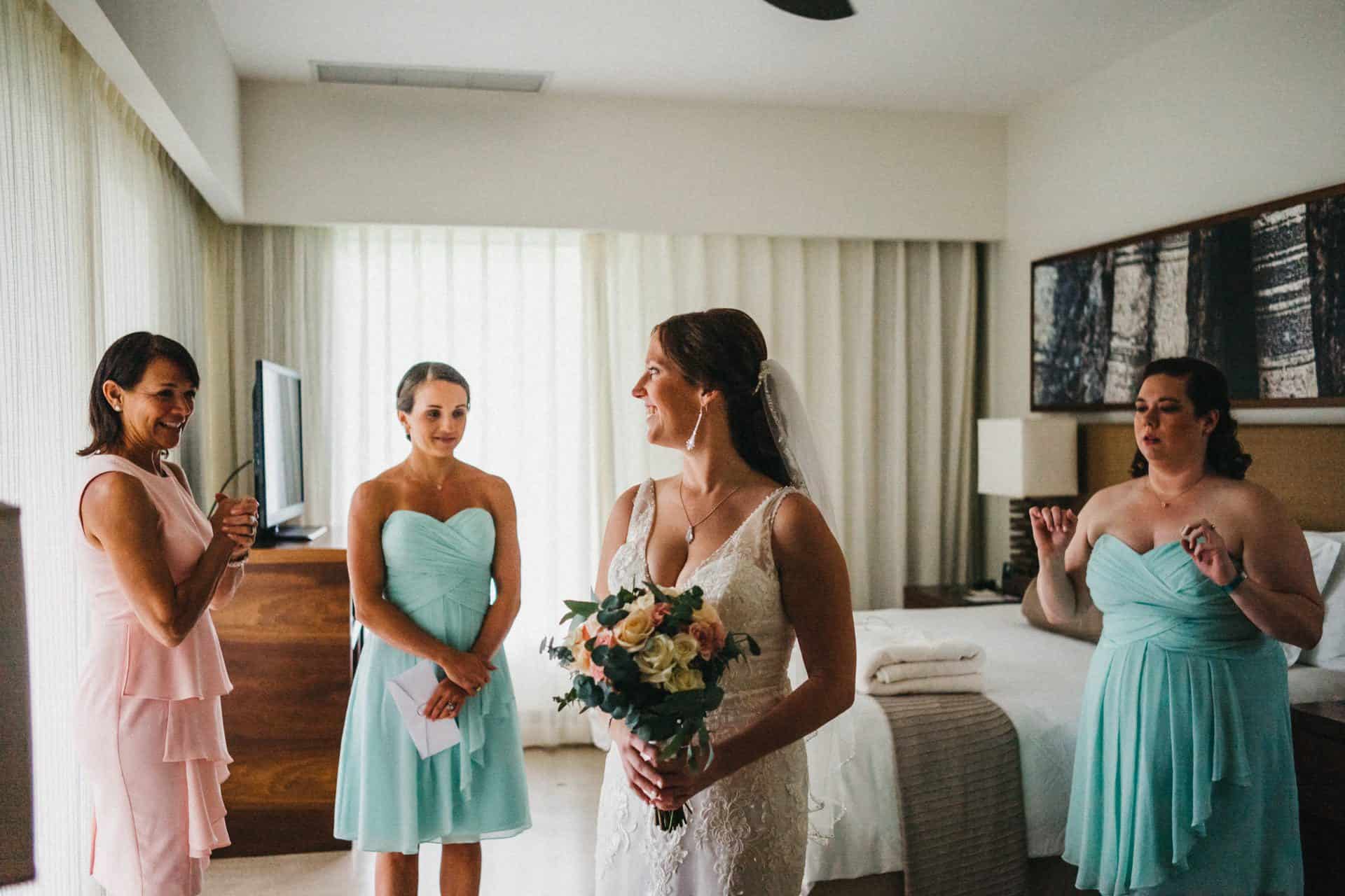 Bride getting ready with bridesmaids and her mother at beach wedding at El Mangroove hotel in papagayo costa rica