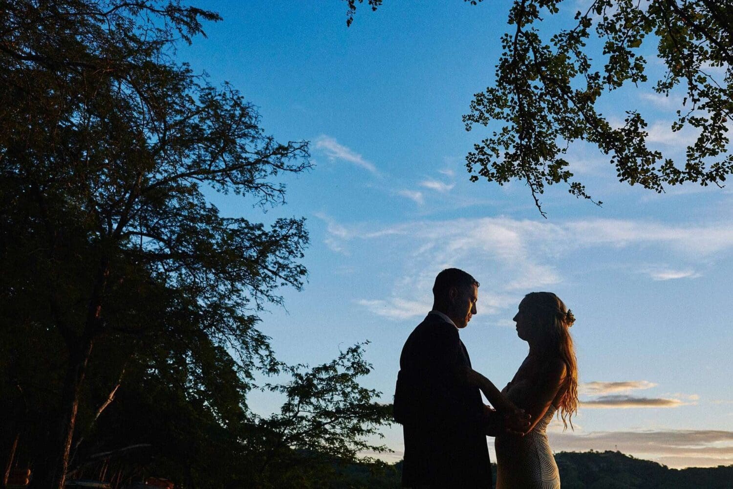 Couple looking each other surrounded by nature on their beach wedding in costa rica