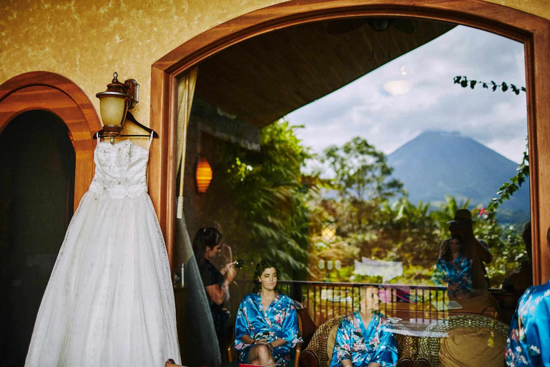 wedding dress hanging outside the room on costa rican wedding