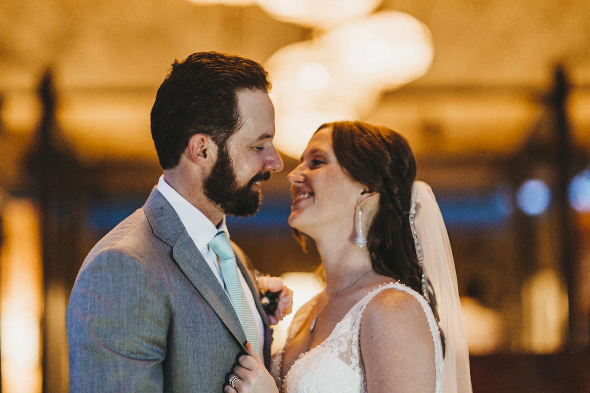 Elizabeth and Ryan embrace on the beach during their El Mangroove Papagayo wedding in Costa Rica