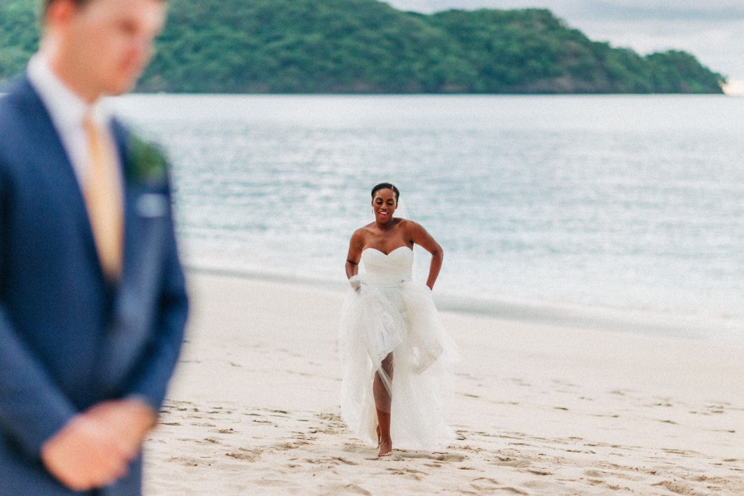 Westin Conchal Wedding Photographer Bride and groom playing by the beach 