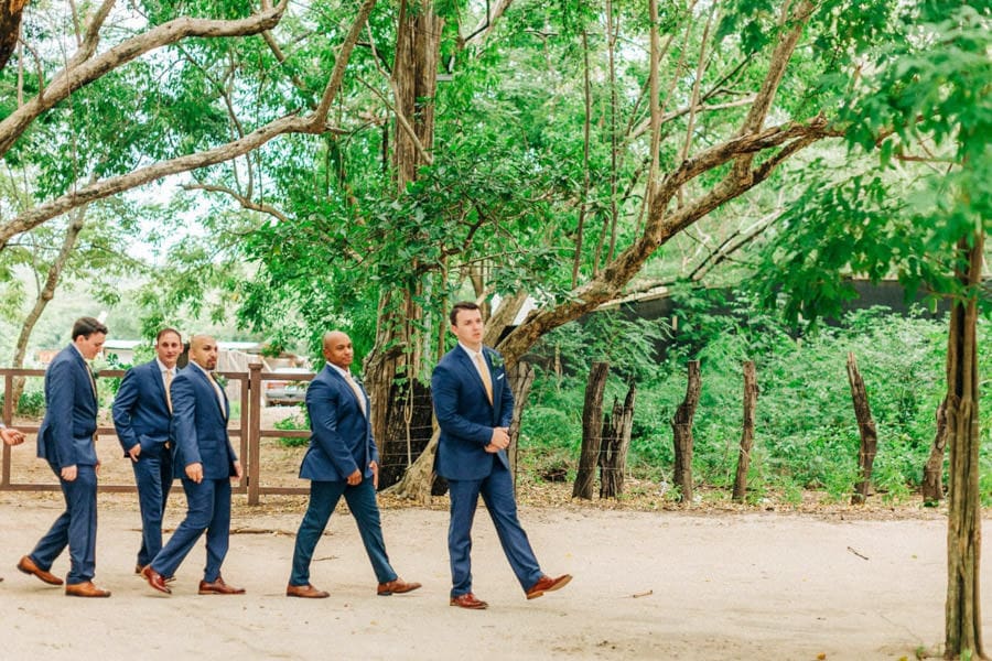 Groom and groomsmen walking together during a wedding at The Westin Reserva Conchal in Costa Rica