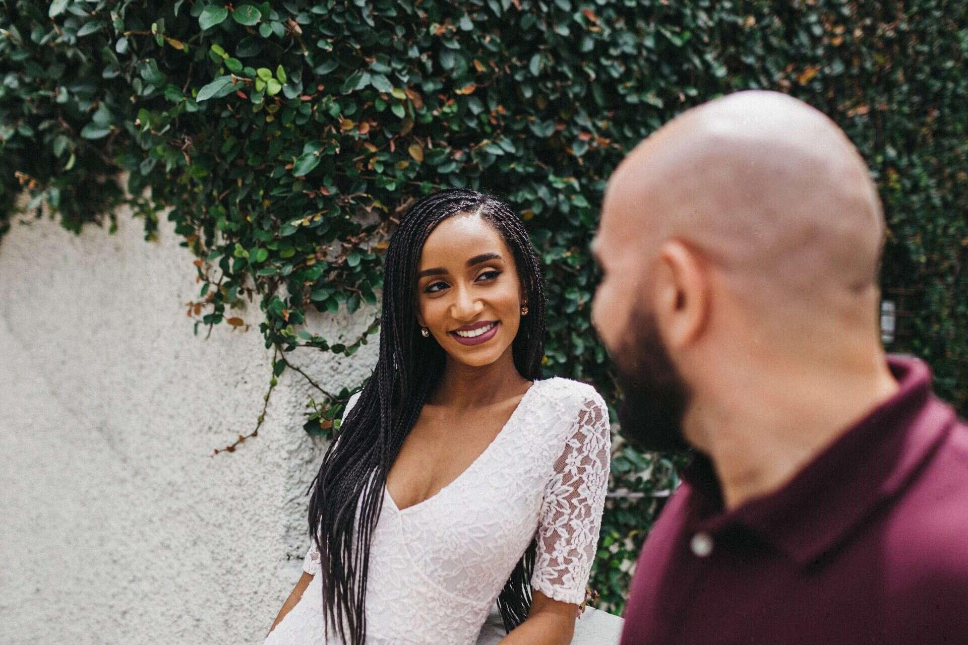 Soft embrace between a couple during an engagement session in Costa Rica, set against a lush, natural backdrop.