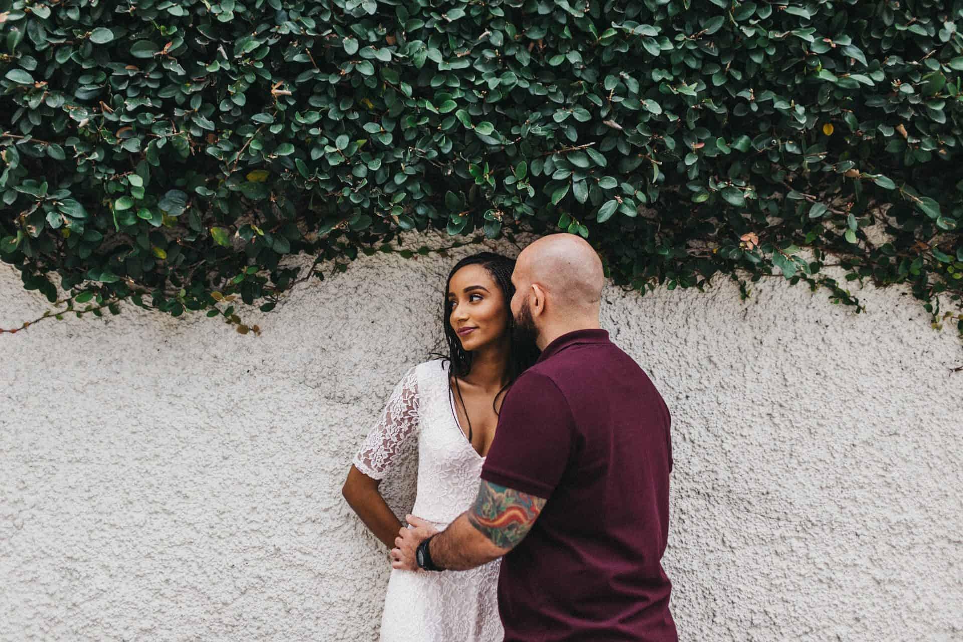 Soft embrace between a couple during an engagement session in Costa Rica, set against a lush, natural backdrop.
