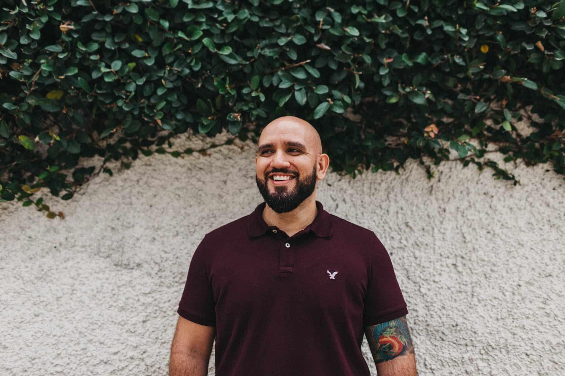 Soft embrace between a couple during an engagement session in Costa Rica, set against a lush, natural backdrop.