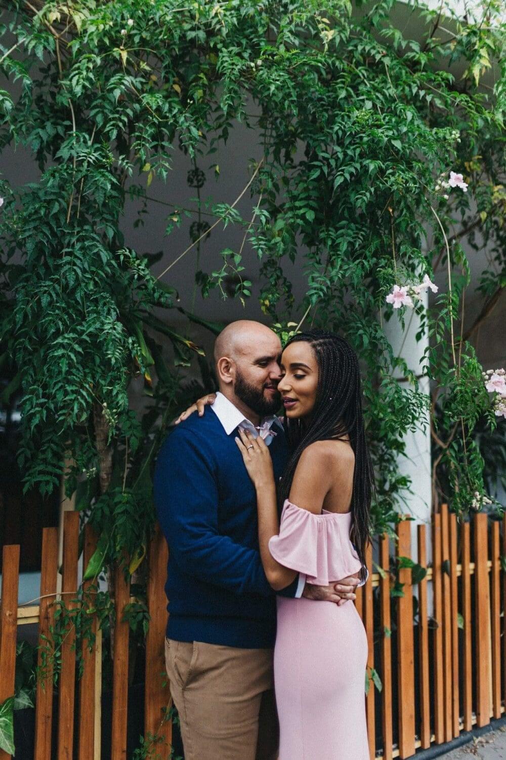 Soft embrace between a couple during an engagement session in Costa Rica, set against a lush, natural backdrop.