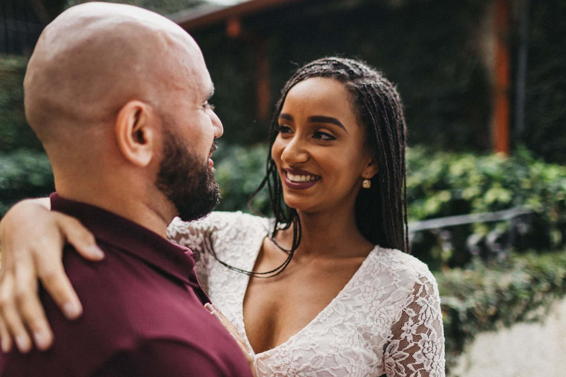 Couple enjoying a romantic engagement session in a historic neighborhood of San José, Costa Rica, surrounded by colorful colonial architecture