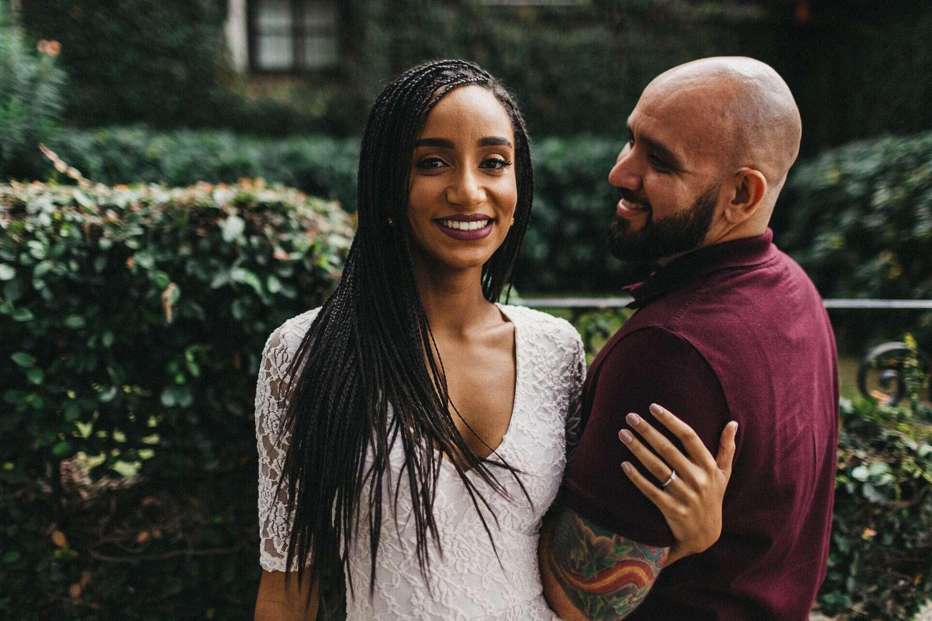 Couple enjoying a romantic engagement session in a historic neighborhood of San José, Costa Rica, surrounded by colorful colonial architecture