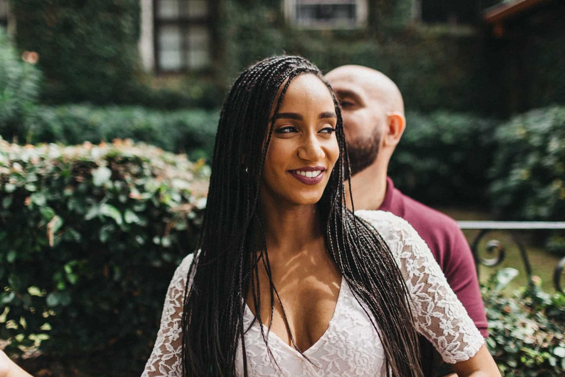 Couple enjoying a romantic engagement session in a historic neighborhood of San José, Costa Rica, surrounded by colorful colonial architecture