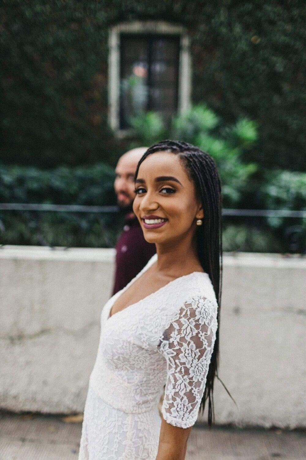 Couple enjoying a romantic engagement session in a historic neighborhood of San José, Costa Rica, surrounded by colorful colonial architecture