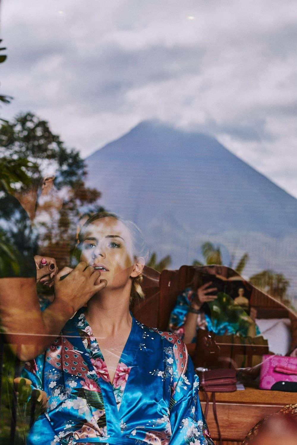 Bride getting ready in front of the Arenal Volcano in La Fortuna, Costa Rica